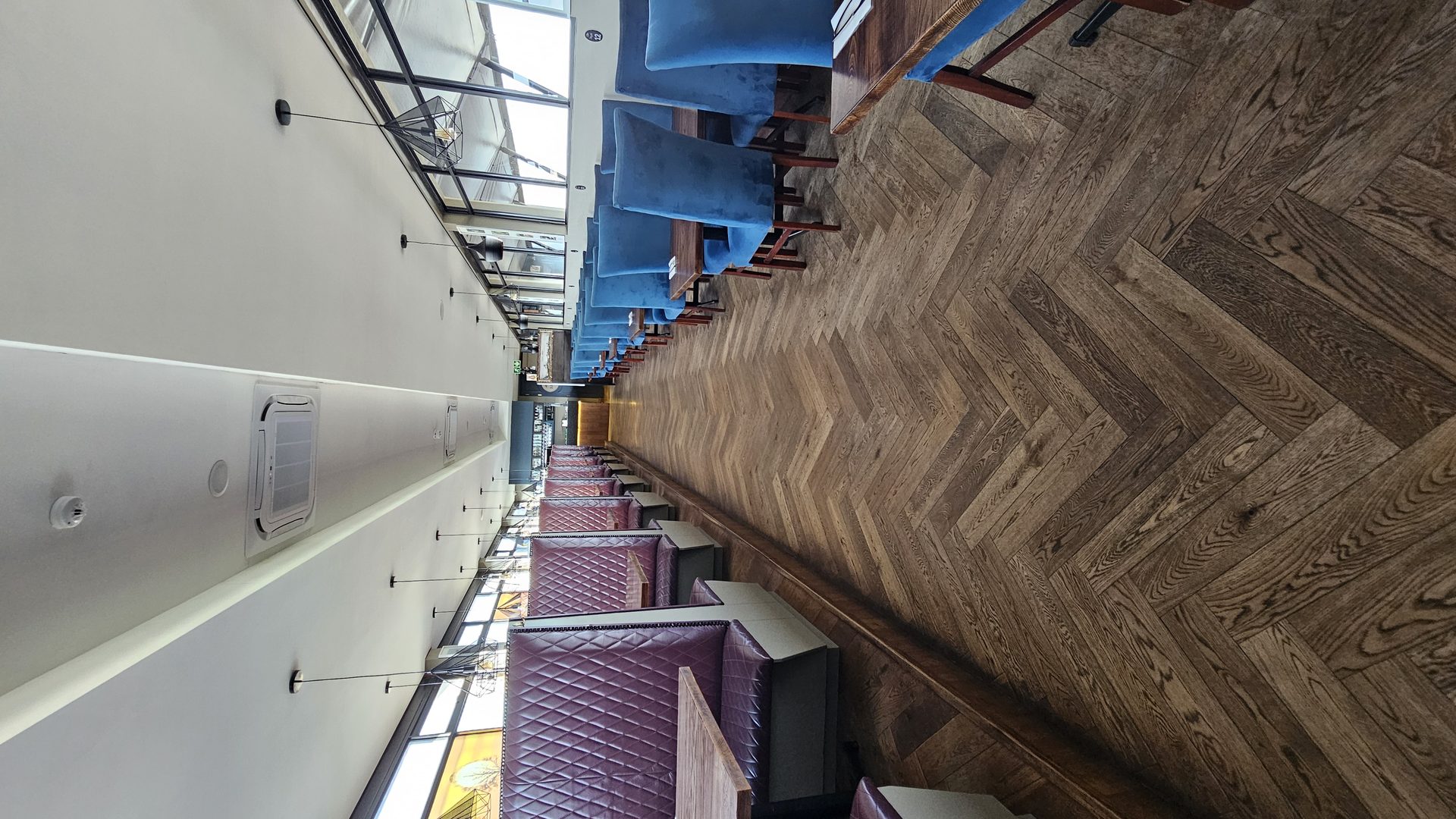 Herringbone floor and quilted booths